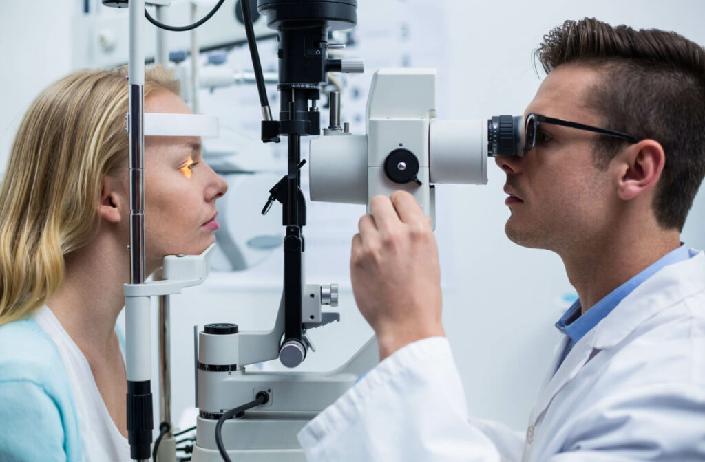 An optometrist talking to her patient in an exam room