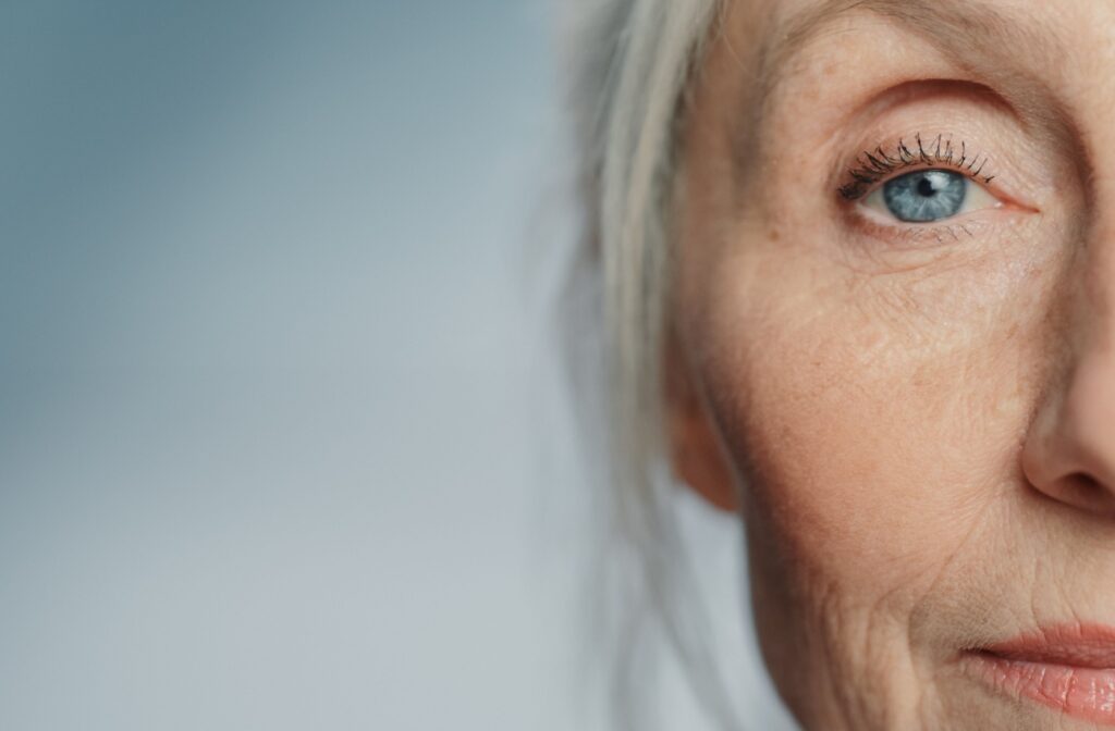 A closeup of a mature woman's blue eyes.